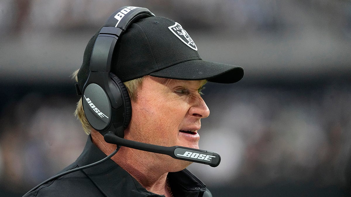 Las Vegas Raiders head coach Jon Gruden stands on the sidelines during the first half of an NFL football game against the Miami Dolphins, Sunday, Sept. 26, 2021, in Las Vegas.