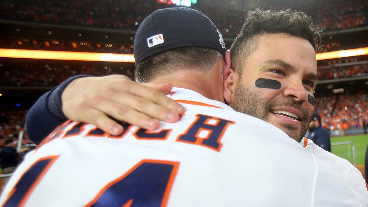Jose Altuve #27 of the Houston Astros celebrates with manager A.J. Hinch #14 after defeating the New York Yankees by a score of 4-0 to win Game Seven of the American League Championship Series at Minute Maid Park on Oct. 21, 2017 in Houston, Texas. The Houston Astros advance to face the Los Angeles Dodgers in the World Series.