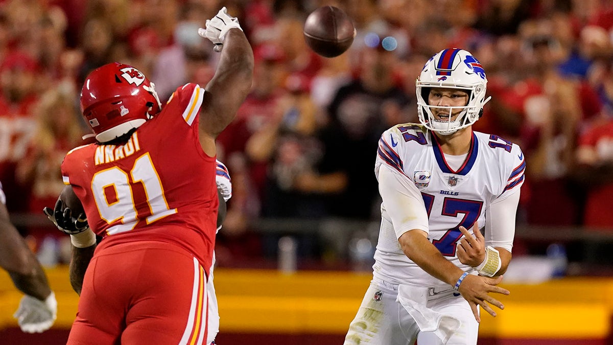 Buffalo Bills quarterback Josh Allen (17) throws over Kansas City Chiefs defensive tackle Derrick Nnadi (91) during the first half of an NFL football game Sunday, Oct. 10, 2021, in Kansas City, Mo.