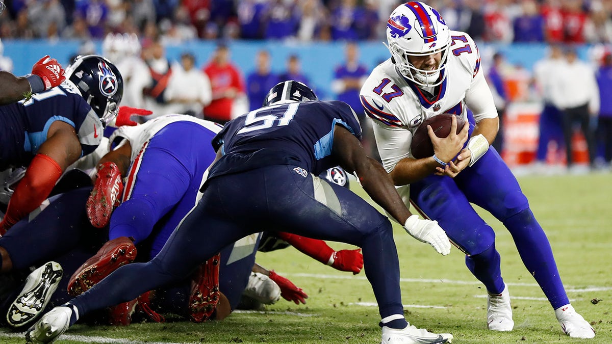 Buffalo Bills quarterback Josh Allen (17) is stopped short of the goal line by Tennessee Titans linebacker David Long Jr. (51) in the second half of an NFL football game Monday, Oct. 18, 2021, in Nashville, Tenn.