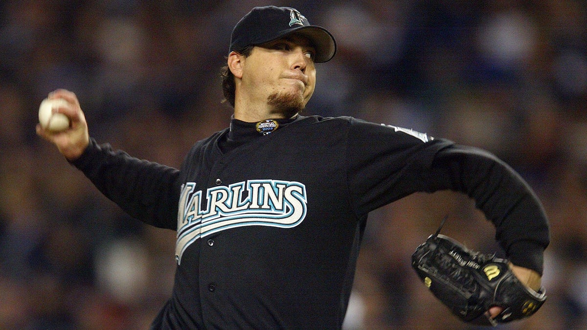 BRONX, NY - OCTOBER 25: Starting pitcher Josh Beckett #21 of the Florida Marlins throws a pitch against the New York Yankees in the first inning during game six of the Major League Baseball World Series on October 25, 2003 at Yankee Stadium in the Bronx, New York.