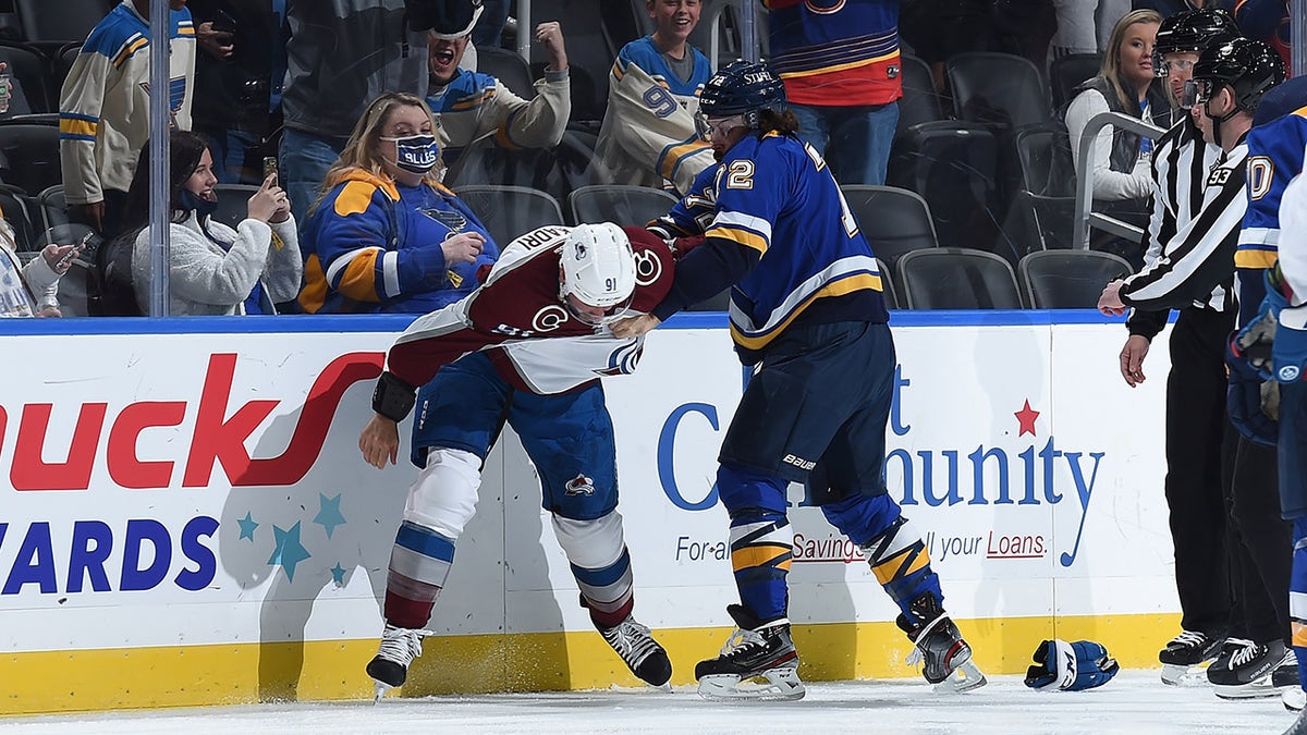 Justin Faulk (72) of the St. Louis Blues gets physical with Nazem Kadri of the Colorado Avalanche at the Enterprise Center on Oct. 28, 2021, in St. Louis, Missouri.