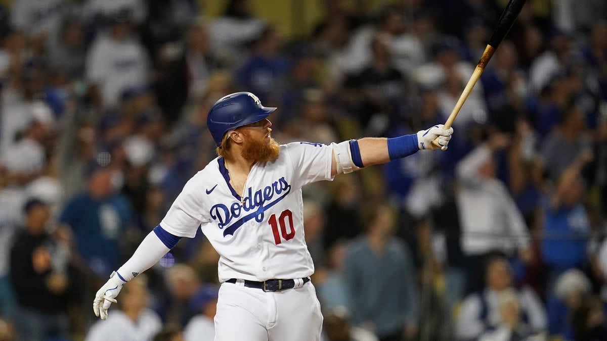 Los Angeles Dodgers' Justin Turner reacts after hitting a solo home run during the fourth inning of a National League Wild Card playoff baseball game against the St. Louis Cardinals Wednesday, Oct. 6, 2021, in Los Angeles.