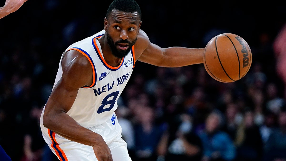 New York Knicks' Kemba Walker (8) drives toward the basket during the second half of an NBA basketball game against the Philadelphia 76ers Tuesday, Oct. 26, 2021, in New York. The Knicks won 112-99.