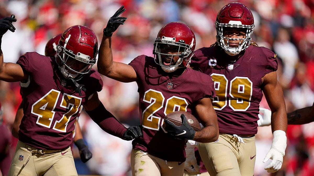 Washington Football Team cornerback Kendall Fuller (29) celebrates his interception with teammates during the first half of an NFL football game against the Kansas City Chiefs, Sunday, Oct. 17, 2021, in Landover, Maryland.