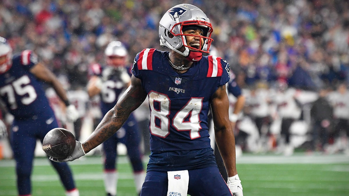 Oct 3, 2021; Foxboro, MA, USA; New England Patriots wide receiver Kendrick Bourne (84) celebrates a touchdown by tight end Hunter Henry (not pictured) against the Tampa Bay Buccaneers during the second quarter at Gillette Stadium.