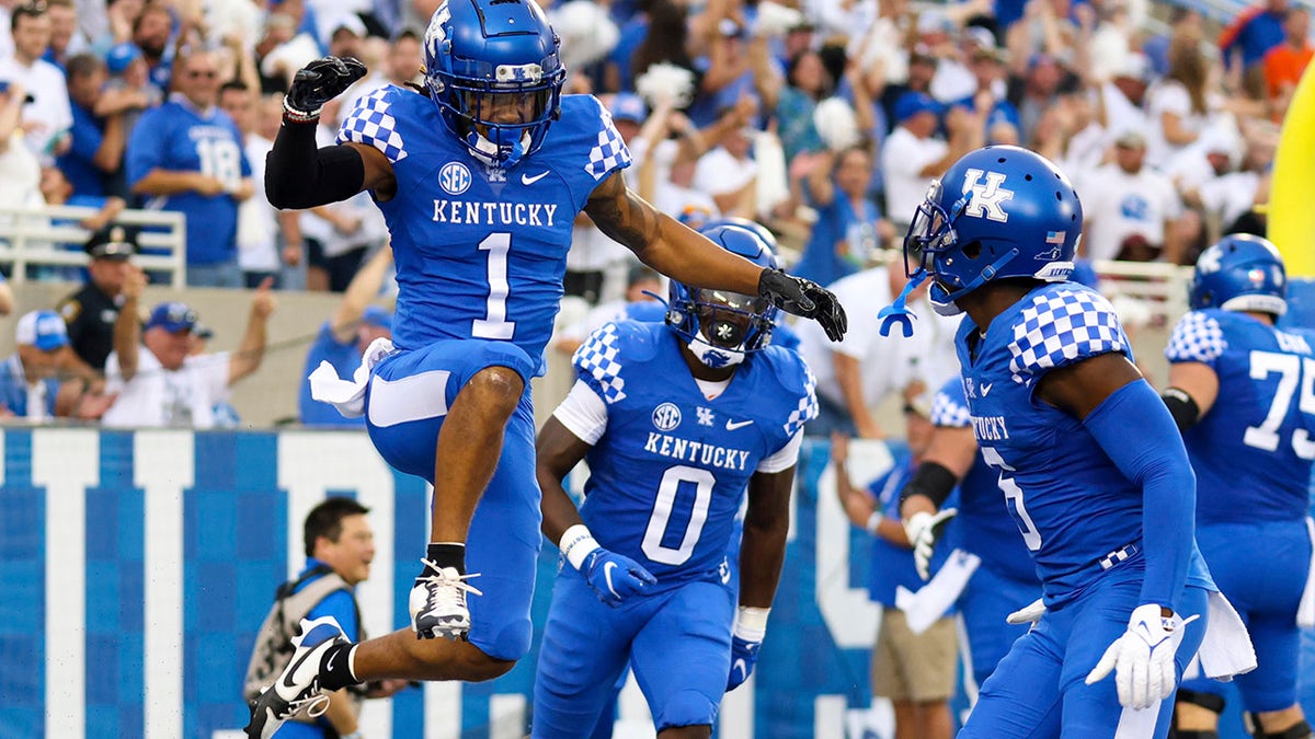 Kentucky wide receiver Wan'Dale Robinson (1) celebrates after scoring a touchdown during the first half of an NCAA college football game against Florida in Lexington, Ky., Saturday, Oct. 2, 2021.