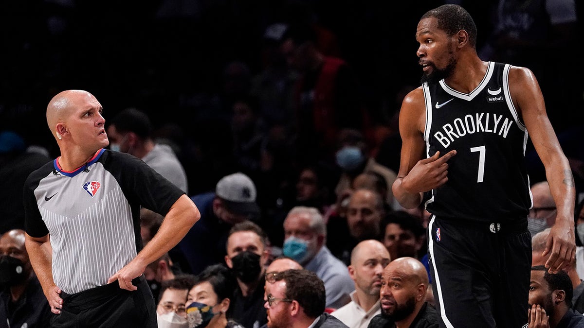 Brooklyn Nets forward Kevin Durant (7) argues with referee Jacyn Goble, left, during the second half of an NBA basketball game, Wednesday, Oct. 27, 2021, in New York.