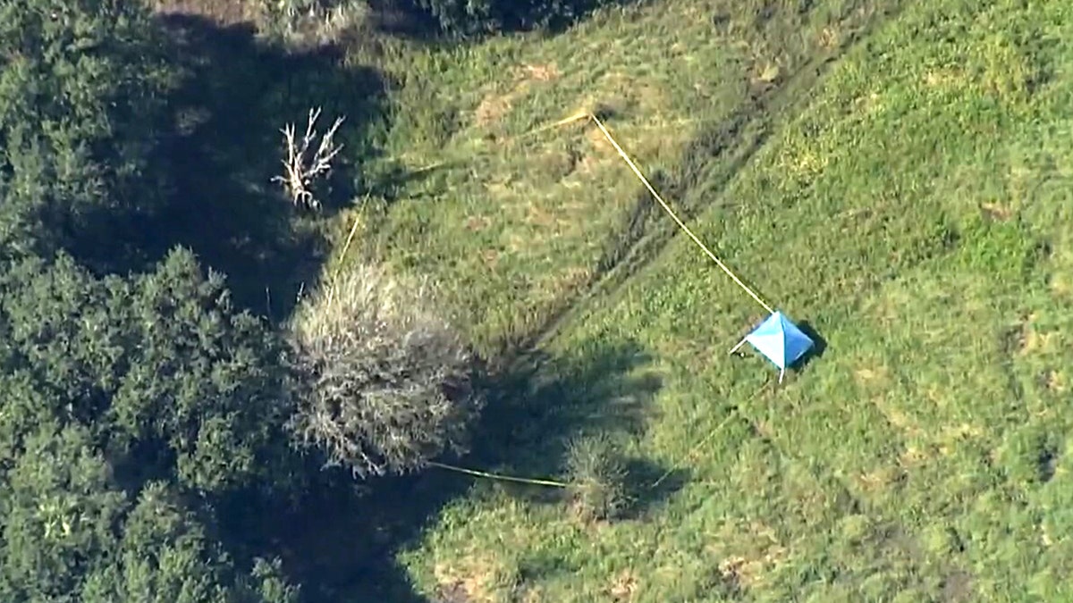 Chris and Roberta Laundrie stood in the same area where Brian Laundrie's remains were found