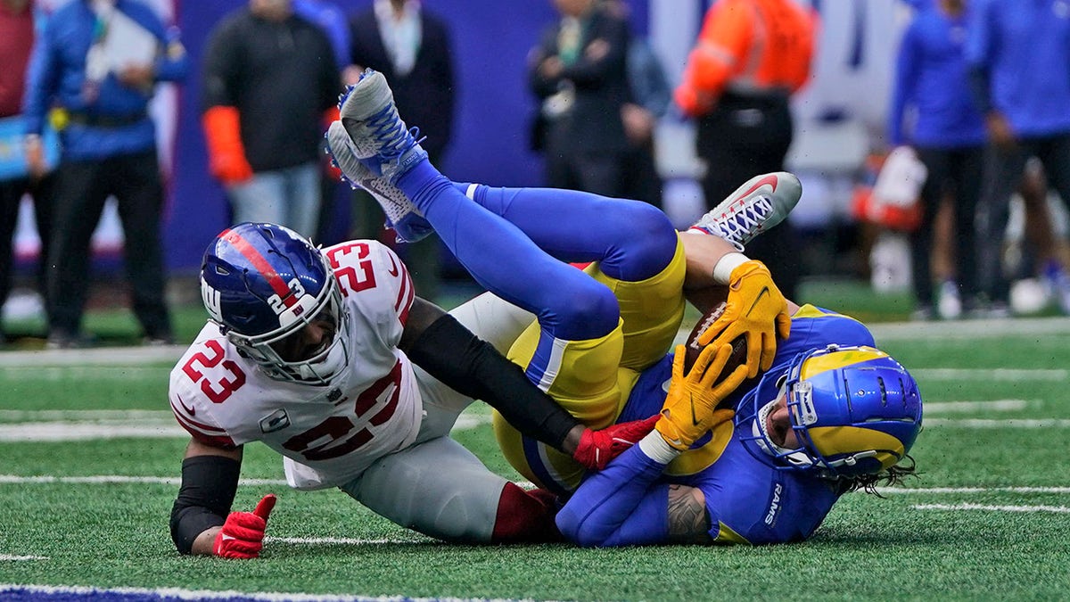 New York Giants' Logan Ryan, left, tackles Los Angeles Rams' Tyler Higbee during the first half of an NFL football game, Sunday, Oct. 17, 2021, in East Rutherford, N.J.