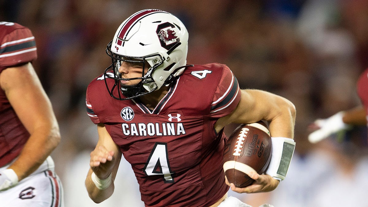 South Carolina quarterback Luke Doty (4) runs with the ball in the second half of an NCAA college football game against Kentucky, Saturday, Sept. 25, 2021 at Williams-Brice Stadium in Columbia, S.C.