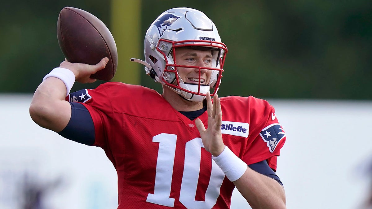 New England Patriots quarterback Mac Jones winds up for a pass during an NFL football practice, Wednesday, Sept. 29, 2021, in Foxborough, Massachusetts.