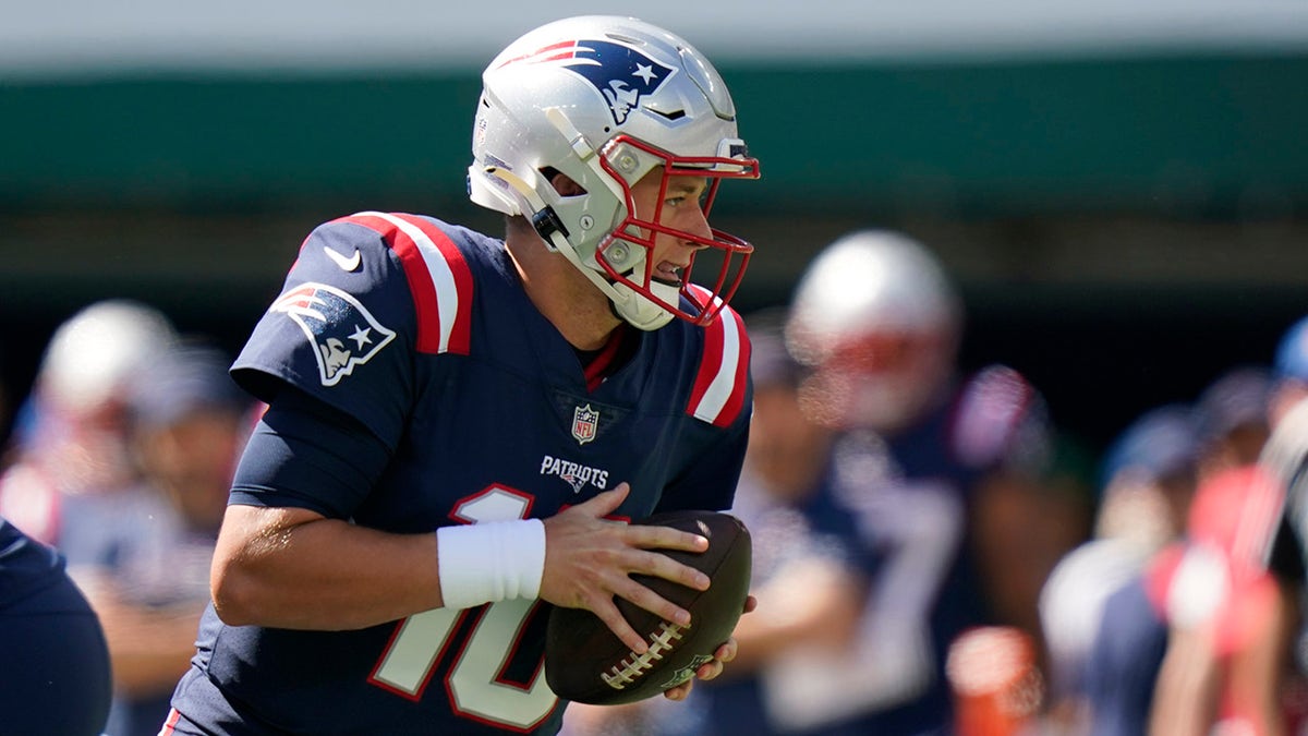 New England Patriots quarterback Mac Jones looks to throw during the first half of an NFL football game against the New York Jets, Sunday, Sept. 19, 2021, in East Rutherford, New Jersey.