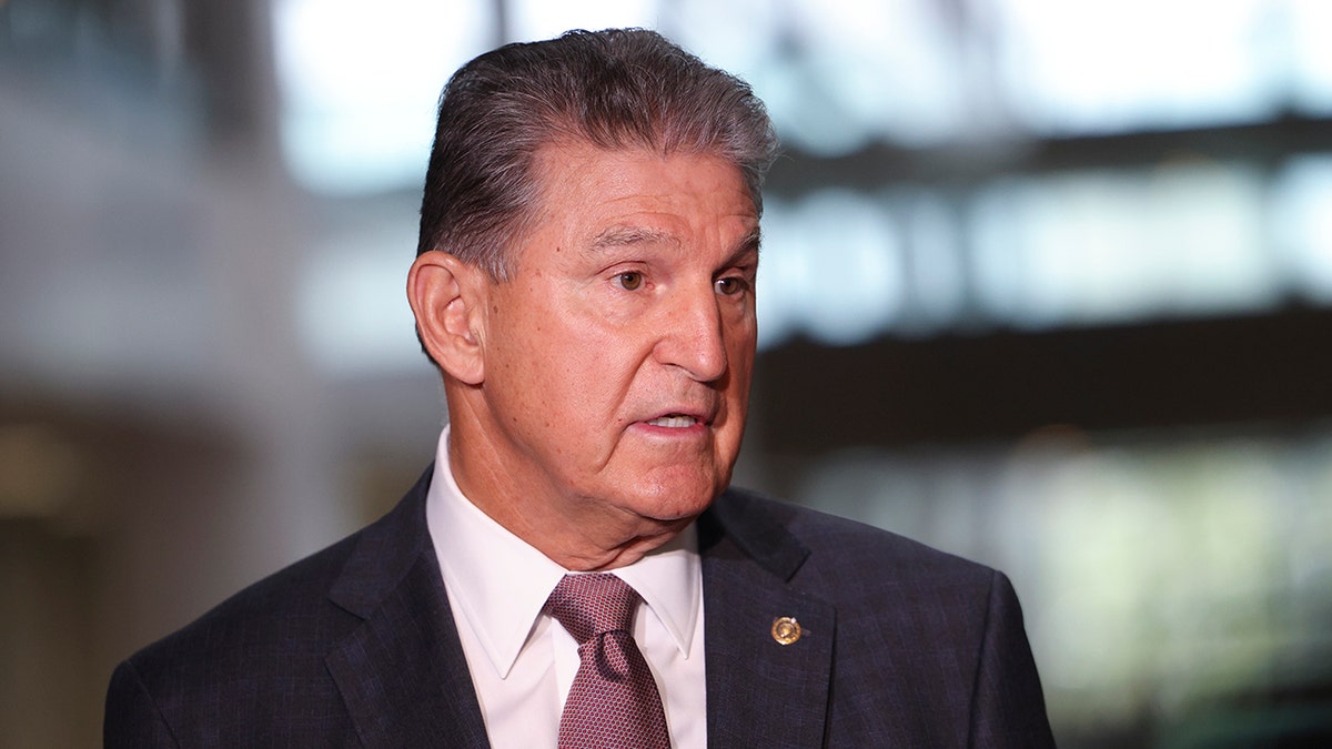 Sen. Joe Manchin, D-W.Va., speaks to reporters outside of his office on Capitol Hill on Oct. 6, 2021, in Washington, D.C. Manchin said he never considered leaving the Democratic Party as a negotiating tactic over his party's spending plans. (Photo by Kevin Dietsch/Getty Images)