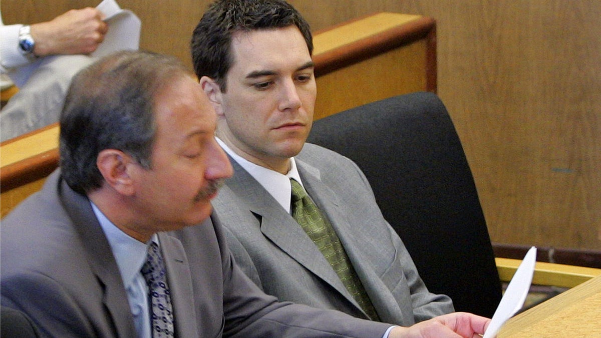 Scott Peterson sits in the courtroom at the San Mateo Superior Courthouse with his attorney Mark Geragos in 2004. Peterson was found guilty of first degree murder of his wife and second degree murder of their unborn son.