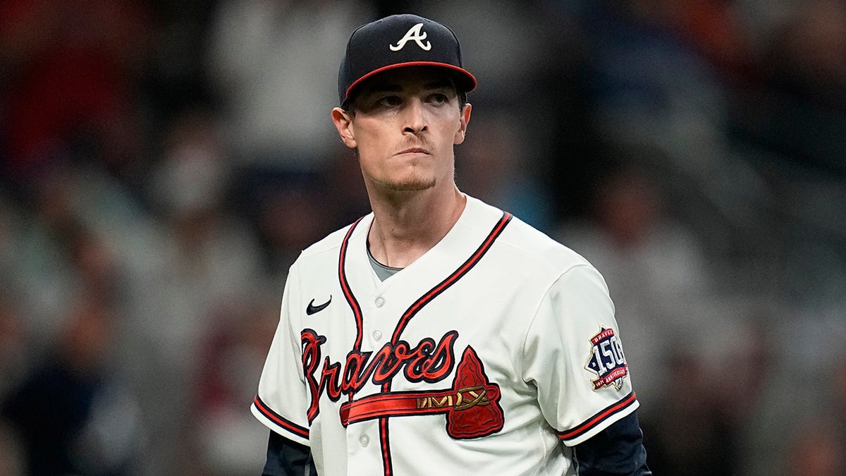 Atlanta Braves pitcher Max Fried walks to the dugout during the fourth inning in Game 1 of baseball's National League Championship Series against the Los Angeles Dodgers Saturday, Oct. 16, 2021, in Atlanta.