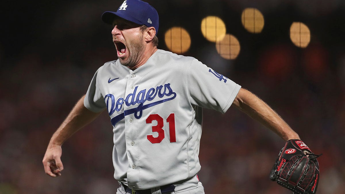 Los Angeles Dodgers pitcher Max Scherzer celebrates after the Dodgers defeated the San Francisco Giants in Game 5 of a baseball National League Division Series Thursday, Oct. 14, 2021, in San Francisco.
