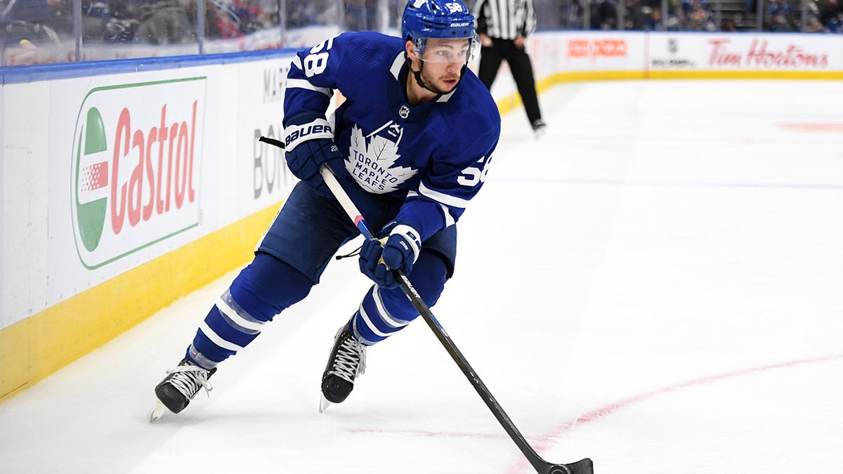 Toronto Maple Leafs forward Michael Bunting (58) skates with the puck against the Ottawa Senators in the second period at Scotiabank Arena in Toronto.