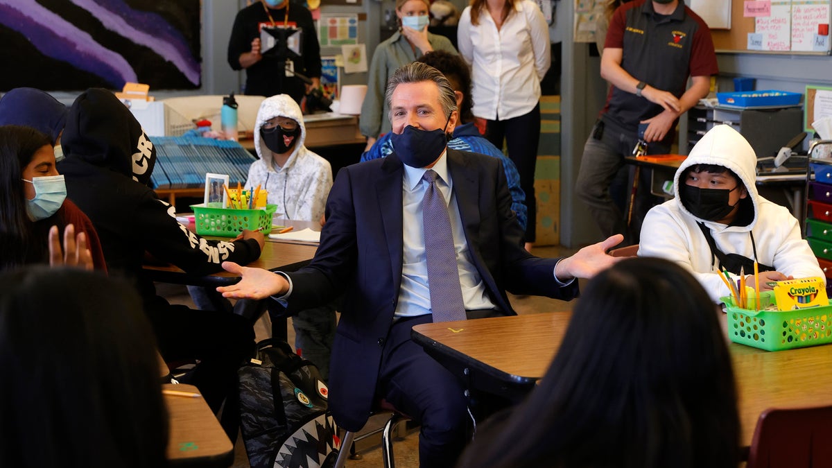 California Gov. Gavin Newsom talks with 7th grade students at James Denman Middle School on October 01, 2021 in San Francisco, California. (Photo by Justin Sullivan/Getty Images)