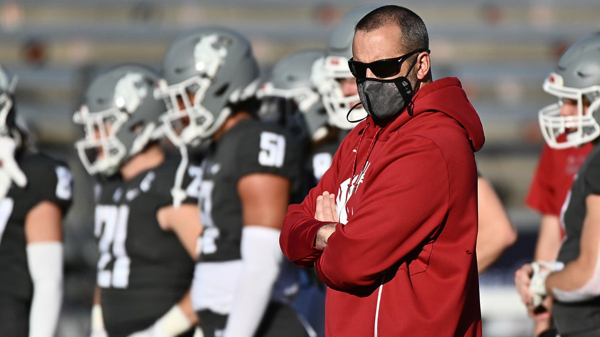 Oct 16, 2021; Pullman, Washington, USA; Washington State Cougars head coach Nick Rolovich looks on during warm up ups before a game against the Stanford Cardinal at Gesa Field at Martin Stadium.