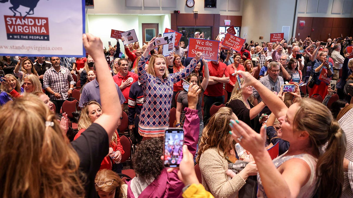 Amy Jahr sings the Star Spangled Banner after a Loudoun County School Board meeting was halted by the school board because the crowd refused to quiet down, in Ashburn, Virginia, June 22, 2021.?