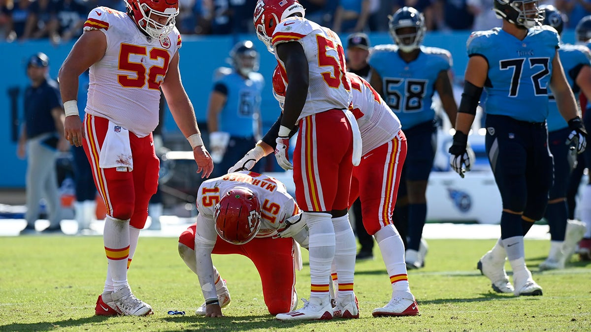 Kansas City Chiefs quarterback Patrick Mahomes (15) slowly gets up after being hit in the second half of an NFL football game against the Tennessee Titans Sunday, Oct. 24, 2021, in Nashville, Tenn.
