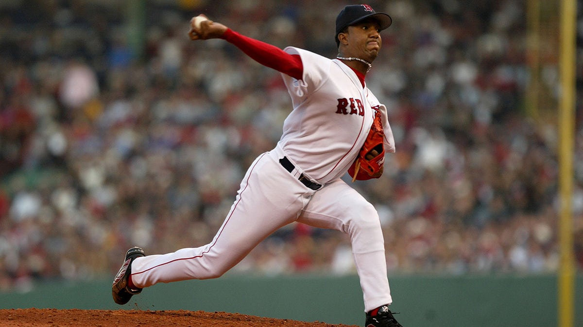 Boston Red Sox starting pitcher Pedro Martinez delivers a pitch