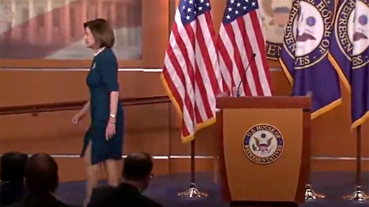 House Speaker Nancy Pelosi exits her position.