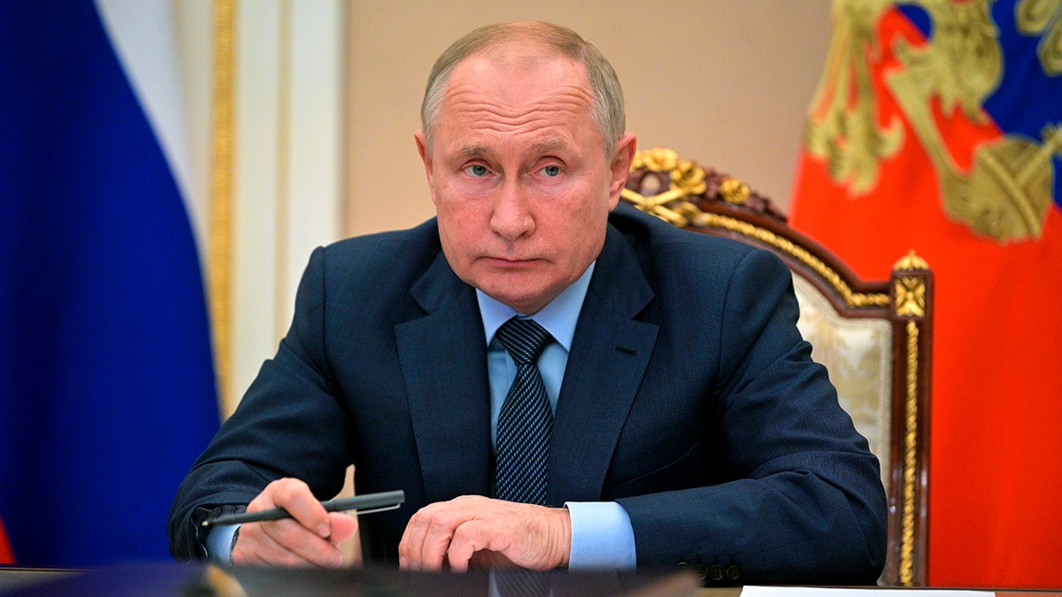 Russian President Vladimir Putin attends a meeting with the heads of the intelligence services of the Commonwealth of Independent States (CIS) countries via teleconference in Moscow, Russia, Wednesday, Oct. 13, 2021. (Alexei Druzhinin, Sputnik, Kremlin Pool Photo via AP)