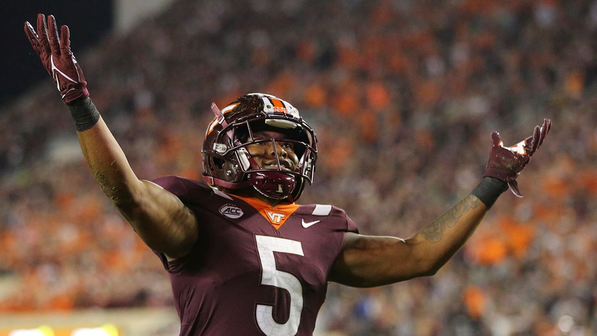 Virginia Tech running back Raheem Blackshear (5) celebrates after scoring a touchdown against Notre Dame during the first half of an NCAA college football game in Blacksburg, Va., Saturday, Oct. 9, 2021.