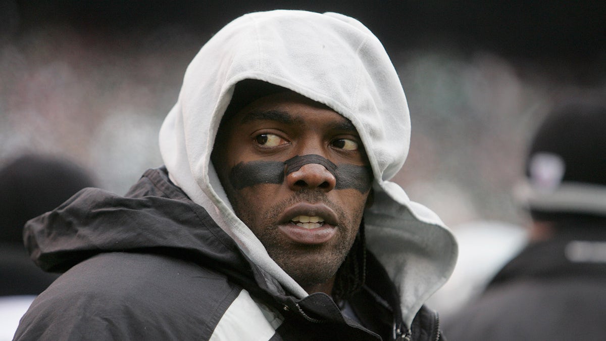 Randy Moss #18 of the Oakland Raiders looks to the sidelines during the game against the New York Jets on December 18, 2005 at Giants Stadium in East Rutherford, New Jersey. The Jets defeated the Raiders 26-10.