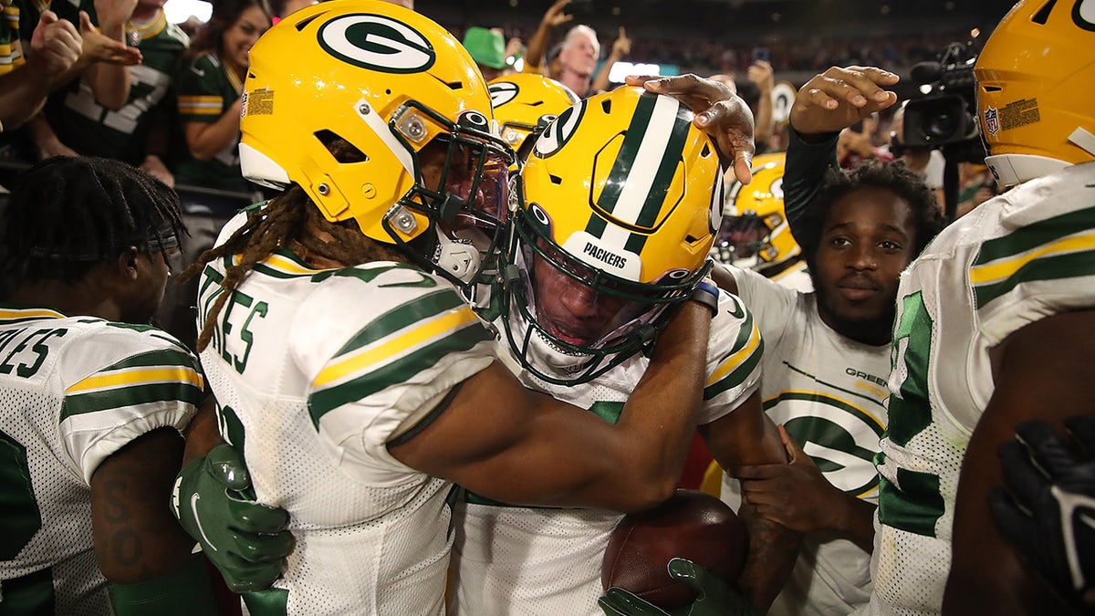 GLENDALE, ARIZONA - OCTOBER 28: Eric Stokes #21 of the Green Bay Packers congratulates Rasul Douglas #29 following an interception during the fourth quarter of a game against the Arizona Cardinals at State Farm Stadium on October 28, 2021 in Glendale, Arizona.