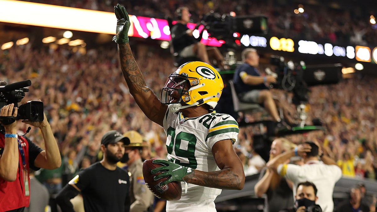 GLENDALE, ARIZONA - OCTOBER 28: Rasul Douglas #29 of the Green Bay Packers celebrates following an interception during the fourth quarter of a game against the Arizona Cardinals at State Farm Stadium on October 28, 2021 in Glendale, Arizona. The Packers defeated the Cardinals 24-21.