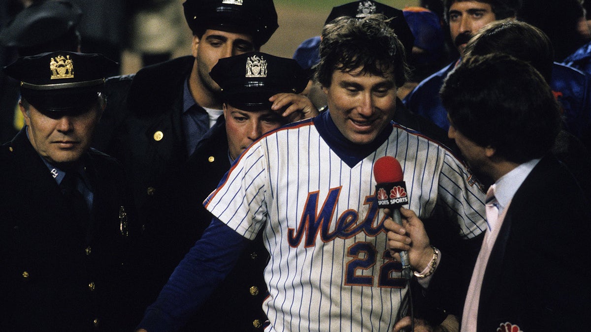 Ray Knight #22 of the New York Mets being interviewed by Marv Albert after the Mets win Game 7 of the 1986 World Series against the Boston Red Sox in Shea Stadium on Oct. 27, 1986 in Flushing, New York.