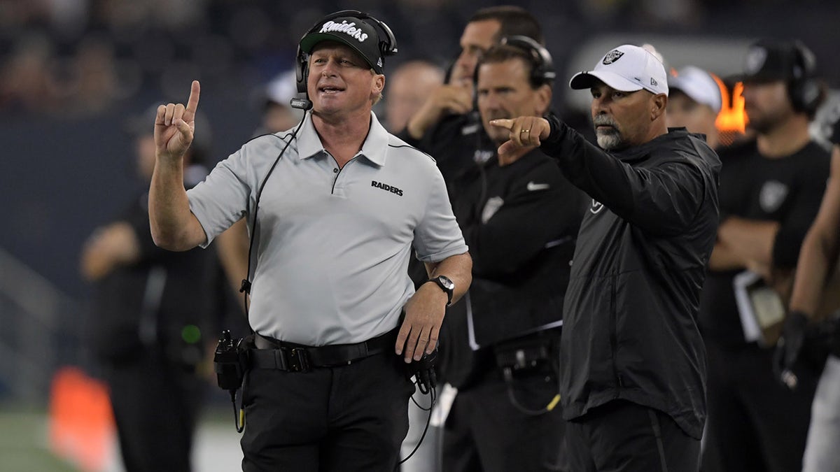 Aug 22, 2019; Winnipeg, Manitoba, CAN; Oakland Raiders head coach Jon Gruden (left) and special teams coordinator Rich Bisaccia watch from the sidelines against the Green Bay Packers in the second half at Investors Group Field. The Raiders defeated the Packers 22-21.