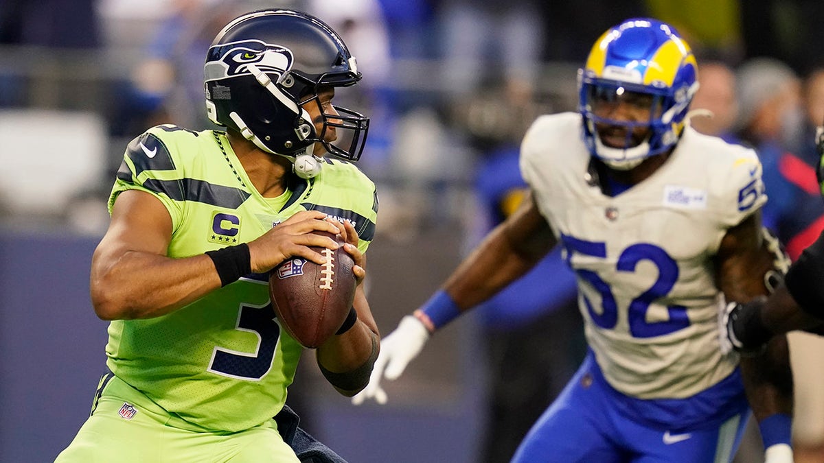 Seattle Seahawks quarterback Russell Wilson (3) passes against the Los Angeles Rams during the first half of an NFL football game, Thursday, Oct. 7, 2021, in Seattle.