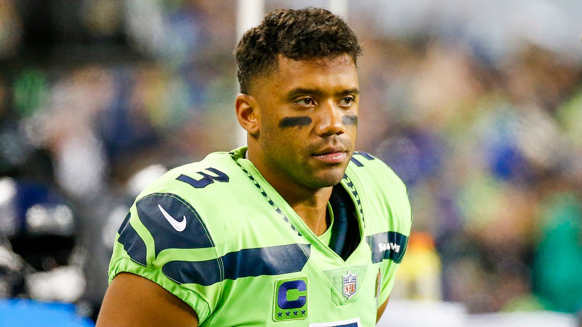 Seattle Seahawks quarterback Russell Wilson stands on the sideline during the fourth quarter against the Los Angeles Rams at Lumen Field.