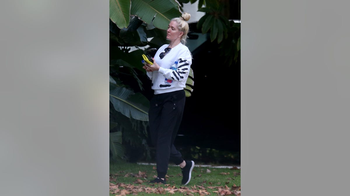 Host Andy Cohen questioned the reality TV star over legal accusations Jayne is facing.