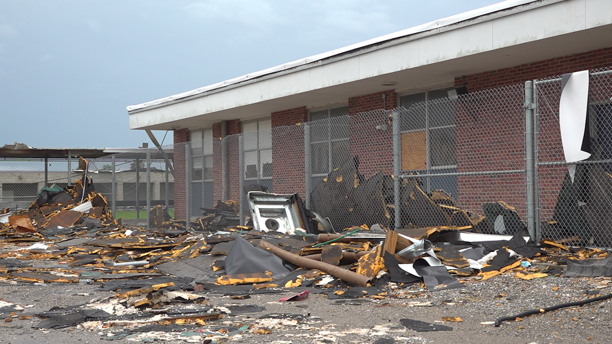 The school yard at South Lafourche High School is filled with debris from Hurricane Ida.