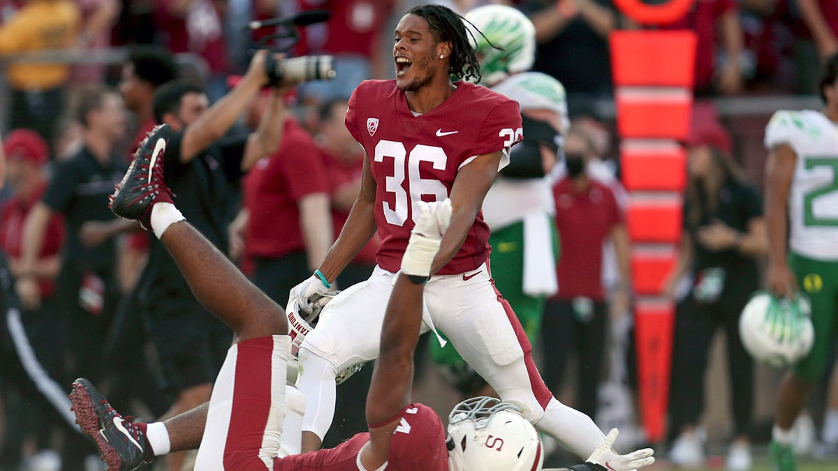 Stanfords' Jaden Slocum (36) and Jacob Mangum-Farrar (14) celebrate after defeating Oregon in an NCAA college football game in Stanford, Calif., Saturday, Oct. 2, 2021.