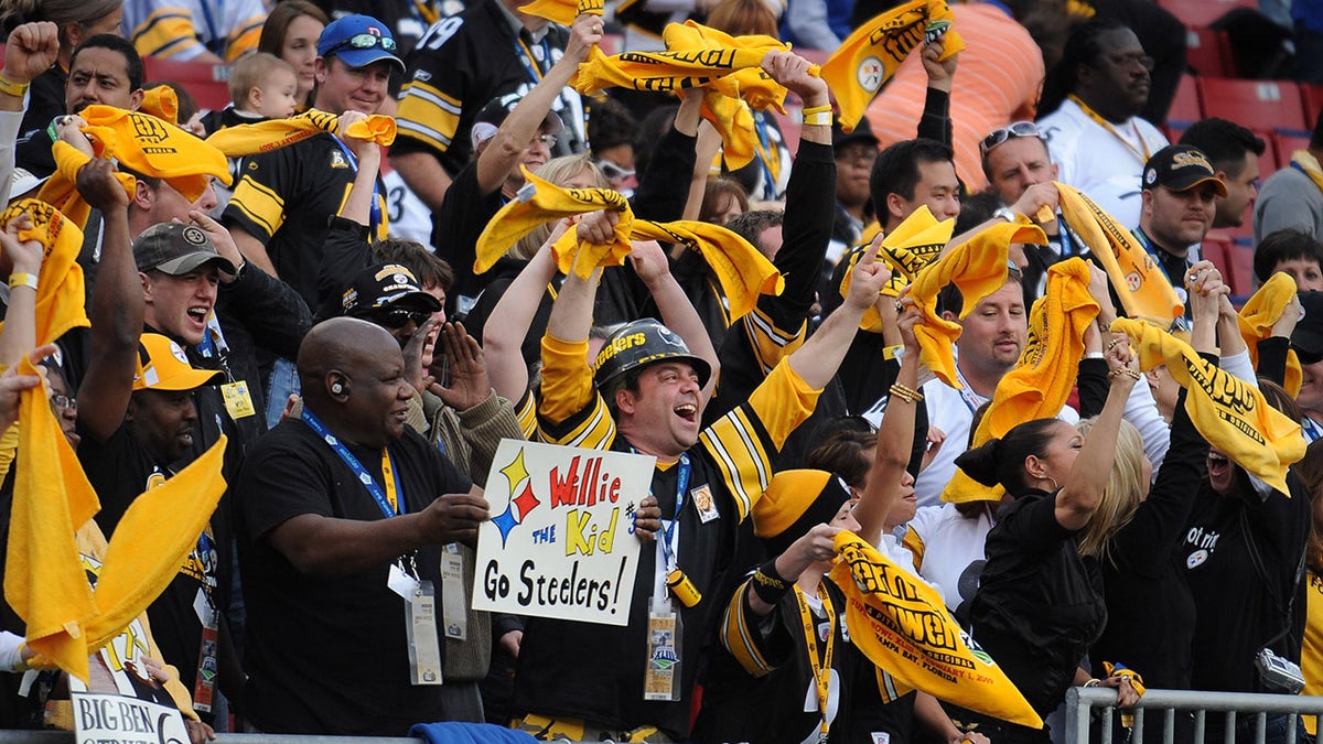 Pittsburgh Steelers fans wave Terrible Towels during the Steelers' 27-23 victory over the Arizona Cardinals at Raymond James Stadium.
