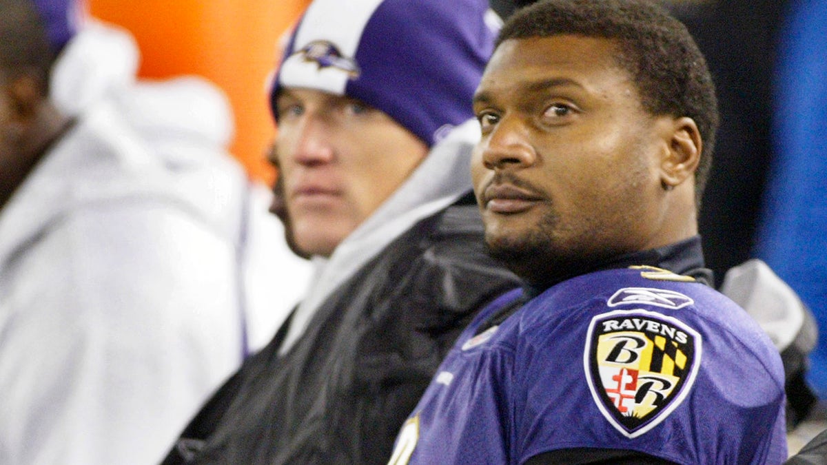 Baltimore Ravens quarterback Steve McNair sits on the bench after being taken out of the game in the fourth quarter of their NFL football game against the Cincinnati Bengals in Baltimore, Maryland, Nov. 11, 2007. Ravens tight end Todd Heap is seated to the left of McNair.