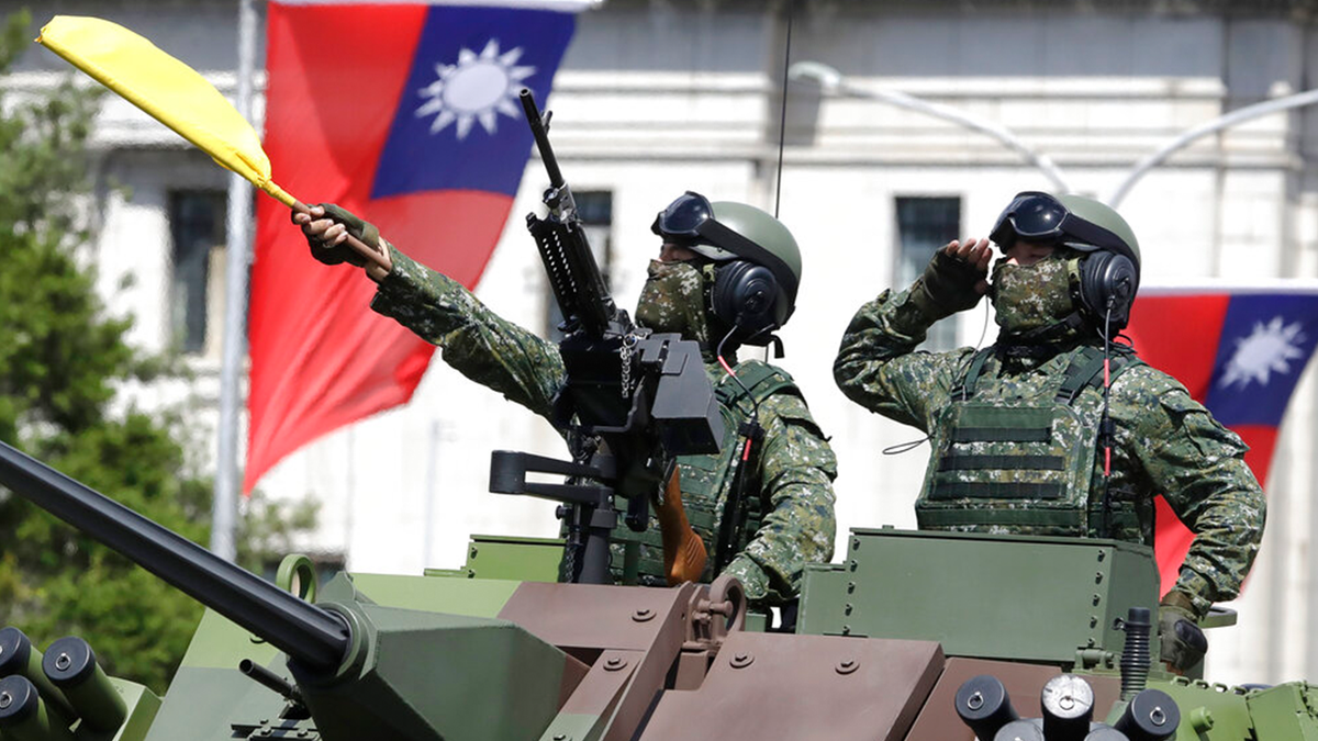 Taiwan soldiers in parade in armored carrier