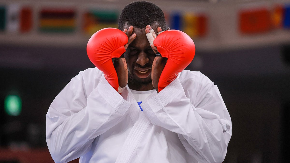 Tareg Hamedi of Team Saudi Arabia reacts after loosing to Sajad Ganjzadeh of Team Iran during the Men's Karate Kumite +75kg Gold Medal Bout on day fifteen of the Tokyo 2020 Olympic Games at Nippon Budokan on Aug. 7, 2021 in Tokyo, Japan. 