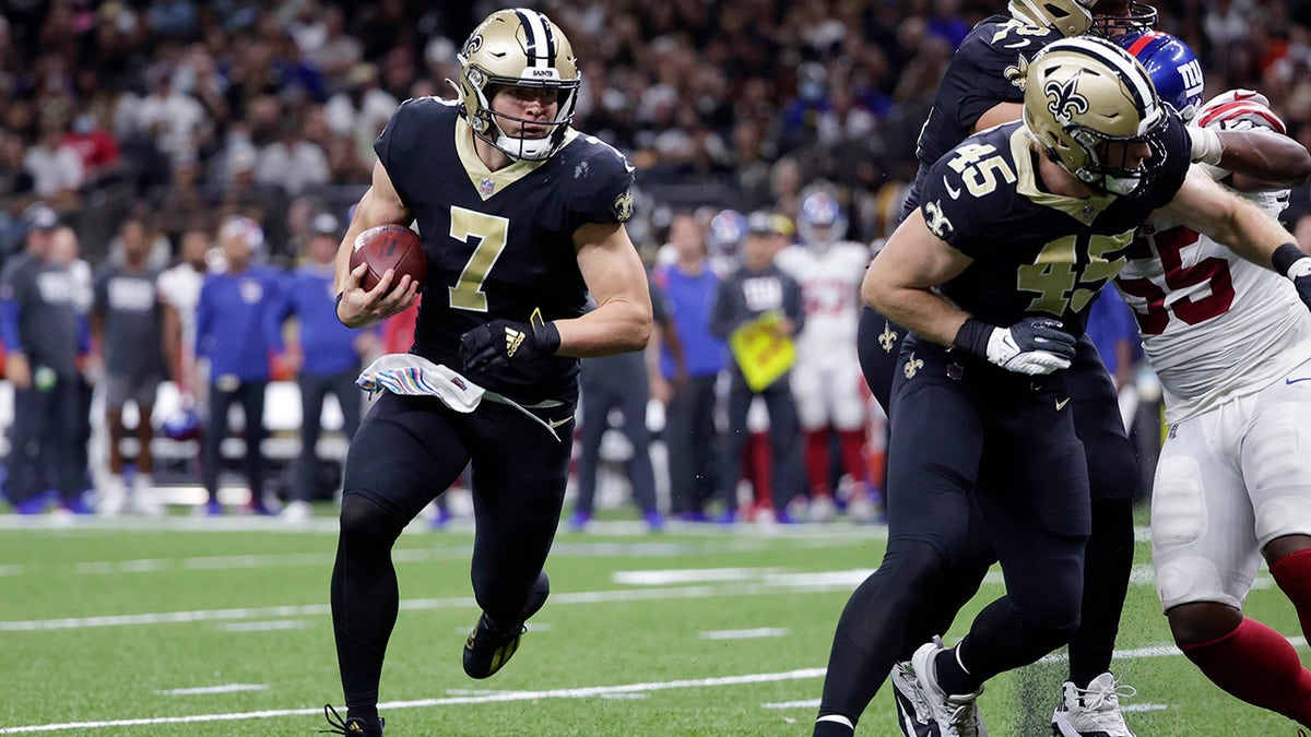 New Orleans Saints quarterback Taysom Hill (7) carries in the first half of an NFL football game against the New York Giants in New Orleans, Sunday, Oct. 3, 2021.