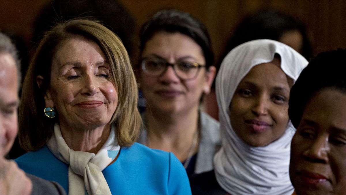 Representative Sheila Jackson Lee, a Democrat from Texas, from right, Representative Ilhan Omar, a Democrat from Minnesota, Representative Rashida Tlaib, a Democrat from Michigan, and U.S. House Speaker Nancy Pelosi, a Democrat from California, listen during a news conference introducing the Equality Act, H.R. 5, with Senate and House Democratic members at the U.S. Capitol in Washington, D.C., U.S., on Wednesday, March 13, 2019. The Equality Act amends the Civil Rights Act of 1964 to prohibit discrimination on the basis of sexual orientation and gender identity in several public and federal services. Photographer: Andrew Harrer/Bloomberg via Getty Images