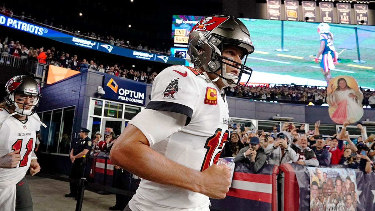 Brady runs onto the field