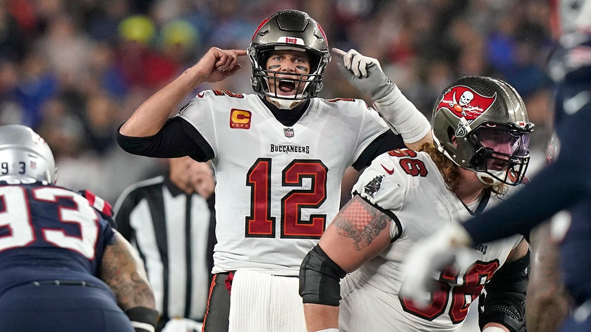 Tampa Bay Buccaneers quarterback Tom Brady (12) calls out a play at the line of scrimmage during the second half of an NFL football game against the New England Patriots, Sunday, Oct. 3, 2021, in Foxborough, Mass.