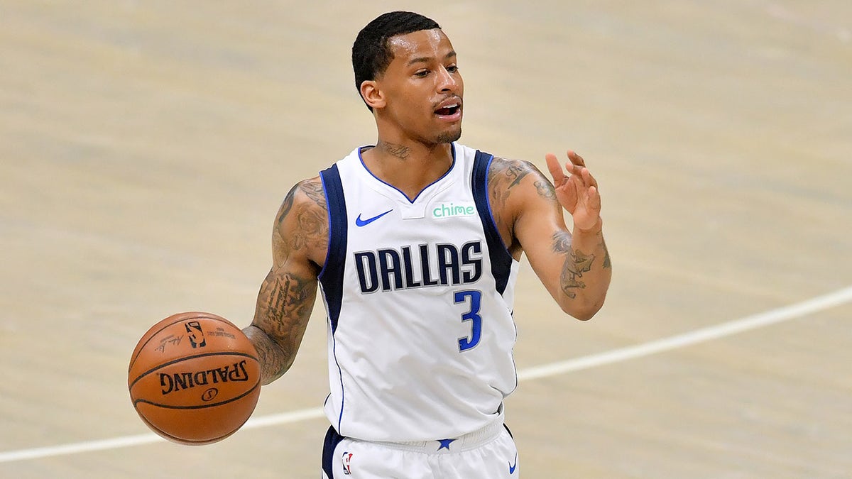 CLEVELAND, OHIO - MAY 09: Trey Burke #3 of the Dallas Mavericks  brings the ball up court during the second half against the Cleveland Cavaliers at Rocket Mortgage Fieldhouse on May 09, 2021 in Cleveland, Ohio. The Mavericks defeated the Cavaliers 124-97.