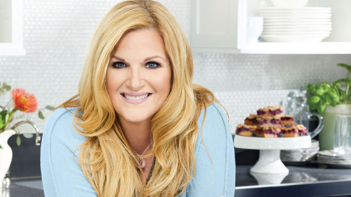 This cover image released by Mariner Books shows 'Trisha’s Kitchen: Easy Comfort Food for Friends and Family' by Trisha Yearwood.